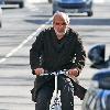 Alan Yentob rides his bicycle in West London London.