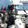 Baz Luhrmann leaves Bondi Beach on his Vespa scooter after a swim. Sydney.