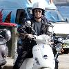 Baz Luhrmann leaves Bondi Beach on his Vespa scooter after a swim. Sydney.