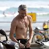 Baz Luhrmann leaves Bondi Beach on his Vespa scooter after a swim. Sydney.