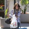 Jennifer Love Hewitt chats on her mobile phone as she takes food to go in Toluca Lake. Los Angeles, California.