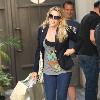 Cougar Town' star Busy Phillips carrying large shopping bags while out shopping at The Grove. 
Los Angeles, California.