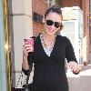 Bree Turner carrying a small Barney's shopping bag and drinking coffee while out and about in Beverly Hills
Los Angeles, California.
