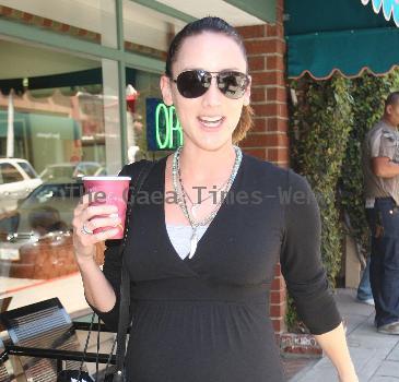 Bree Turner carrying a small Barney's shopping bag and drinking coffee while out and about in Beverly Hills
Los Angeles, California.