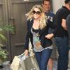 Cougar Town' star Busy Phillips carrying large shopping bags while out shopping at The Grove. 
Los Angeles, California.