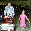 Australian cricketer Glenn McGrath arrives into Sydney International Airport on a late flight and is greeted by his daughter.
Sydney, Australia.