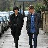 Agyness Deyn with a male friend
takes a stroll. The supermodel with a Canon camera around her neck.
London, England.