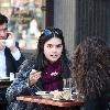 Katie Lee eating lunch with a friend at Bar Pitti in Manhattan's West Village
New York City, USA.