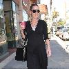 Bree Turner carrying a small Barney's shopping bag and drinking coffee while out and about in Beverly Hills
Los Angeles, Califlrornia.