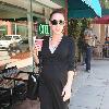 Bree Turner carrying a small Barney's shopping bag and drinking coffee while out and about in Beverly Hills
Los Angeles, Califlrornia.