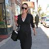 Bree Turner carrying a small Barney's shopping bag and drinking coffee while out and about in Beverly Hills
Los Angeles, Califlrornia.