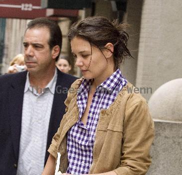 Katie Holmes 
leaving a Manhattan hotel carrying a shopping bag from Bloomingdale's
New York City, USA.