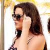 Khloe Kardashian 
wearing one-piece floral shorts while walking with friends
Miami Beach, Florida.