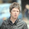 Musician Noel Gallagher 
of Oasis, shops at a grocery supermarket on Marlybone High Street. Afterwards, Noel looks for a bargain in the shop window of Oxfam Books & Music store 
London, England.