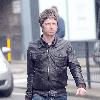 Musician Noel Gallagher 
of Oasis, shops at a grocery supermarket on Marlybone High Street. Afterwards, Noel looks for a bargain in the shop window of Oxfam Books & Music store 
London, England.