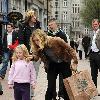 Yummy Mummy and ITV's 'Trial & Retribution' actress Victoria Smurfit seen carrying a Dunnes Stores bag and encouraging her daughter Evie Dorothy Baxter to give money to the buskers outside the St Stephens Green Shopping Centre.
Dublin, Ireland.