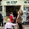 Yummy Mummy and ITV's 'Trial & Retribution' actress Victoria Smurfit seen carrying a Dunnes Stores bag and encouraging her daughter Evie Dorothy Baxter to give money to the buskers outside the St Stephens Green Shopping Centre.
Dublin, Ireland.