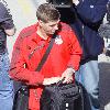 Steven Gerrard
catching a train at Runcorn station as flights out the UK are still halted because of the Icelandic Volcono ash cloud above. The Liverpool football team heading for Spain for their upcomimg UEFA Europa League match against Atletico Madrid.
Cheshire, England.