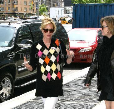 Melanie Griffith 
smoking a cigarette and talking to a friend in Manhattan
New York City, USA.