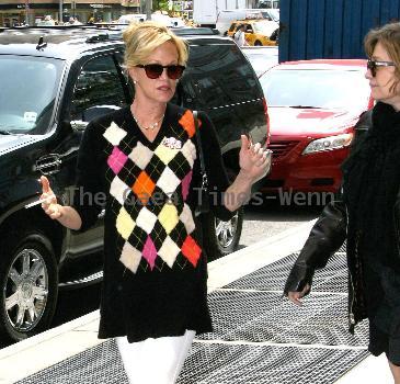 Melanie Griffith 
smoking a cigarette and talking to a friend in Manhattan
New York City, USA.