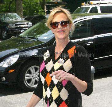Melanie Griffith 
smoking a cigarette and talking to a friend in Manhattan
New York City, USA.