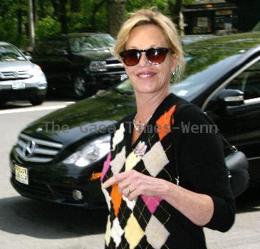 Melanie Griffith 
smoking a cigarette and talking to a friend in Manhattan
New York City, USA.
