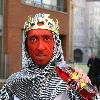 Midget with a red face wearing a St George's Cross, amour suit and crown
promoting 'King Tango' for an adveristing campaign for St Georges Day on the 23rd April.
London, England.