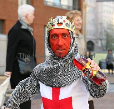 Midget with a red face wearing a St George's Cross, amour suit and crown
promoting 'King Tango' for an adveristing campaign for St Georges Day on the 23rd April.
London, England.