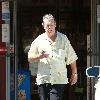 Beach Boys legend Brian Wilson saunters back to his car after buying a bottle of water at a roadside market. 
Los Angeles, California.