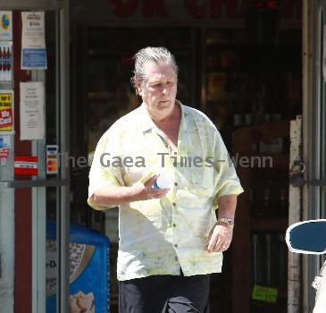 Beach Boys legend Brian Wilson saunters back to his car after buying a bottle of water at a roadside market. 
Los Angeles, California.