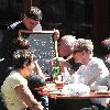 Calvin Klein and friends ordering food at Bar Pitti New York City.