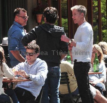 Calvin Klein and friends ordering food at Bar Pitti New York City.