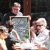 Calvin Klein and friends ordering food at Bar Pitti New York City.