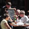 Calvin Klein and friends ordering food at Bar Pitti New York City.