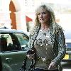 Morgan Fairchild 
walking in Beverly Hills wearing a long gold necklace
Los Angeles, California.