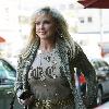 Morgan Fairchild 
walking in Beverly Hills wearing a long gold necklace
Los Angeles, California.