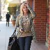 Morgan Fairchild 
walking in Beverly Hills wearing a long gold necklace
Los Angeles, California.