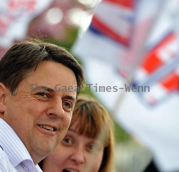 BNP leader Nick Griffin awaits the arrival of David Cameron as the Conservatives  he campaign in Dagenham and Rainham.
London, England.