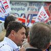 BNP leader Nick Griffin awaits the arrival of David Cameron as the Conservatives  he campaign in Dagenham and Rainham.
London, England.