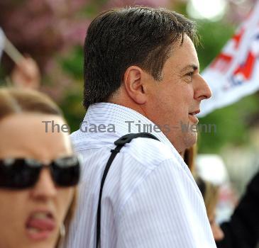 BNP leader Nick Griffin awaits the arrival of David Cameron as the Conservatives  he campaign in Dagenham and Rainham.
London, England.