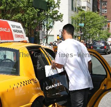 New York Yankees catcher Jorge Posada catches a cab after shopping at Chanel on Madison Avenue New York City.