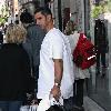 New York Yankees catcher Jorge Posada catches a cab after shopping at Chanel on Madison Avenue New York City.