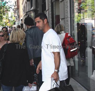 New York Yankees catcher Jorge Posada catches a cab after shopping at Chanel on Madison Avenue New York City.