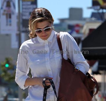 Lake Bell returning to her car with her mother and dog after having lunch at Kings Road Cafe. Los Angeles.