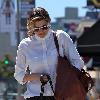 Lake Bell returning to her car with her mother and dog after having lunch at Kings Road Cafe. Los Angeles.