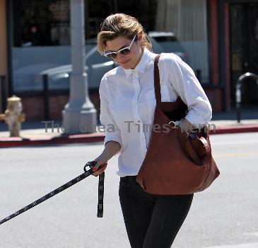 Lake Bell returning to her car with her mother and dog after having lunch at Kings Road Cafe. Los Angeles.