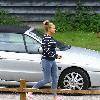 Kerry Katona
outside her house wearing jeggings
Sussex, England.