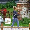 Kerry Katona
outside her house wearing jeggings
Sussex, England.