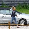 Kerry Katona
outside her house wearing jeggings
Sussex, England.