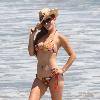 Phoebe Price enjoys the day on Malibu beach Los Angeles.